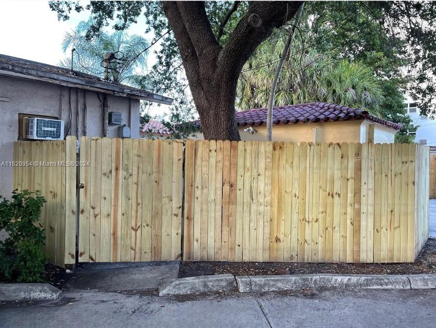 a wooden door in front of a house