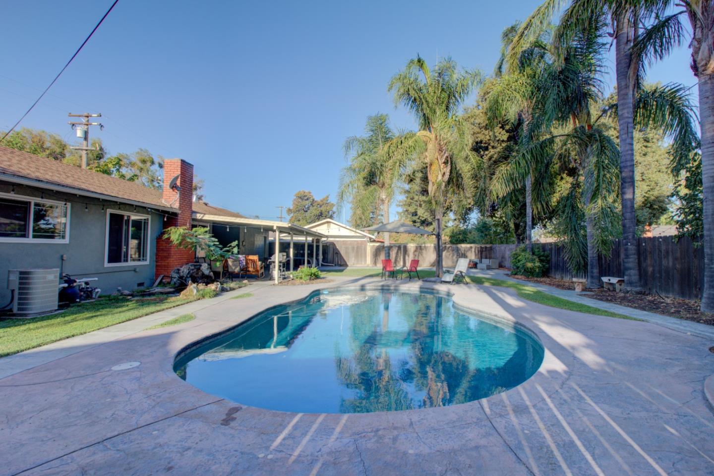 a view of a house with swimming pool