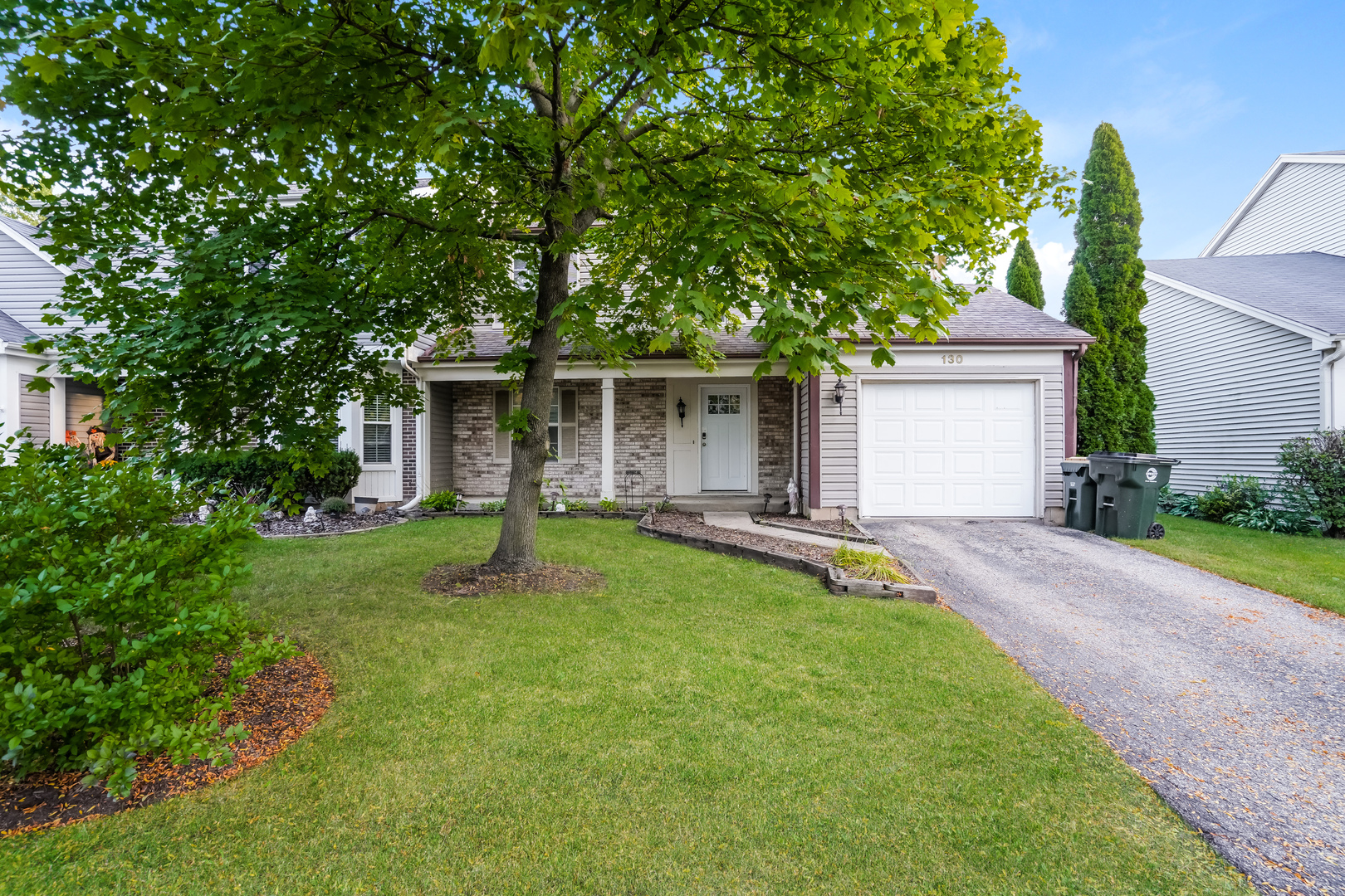 front view of a house with a yard