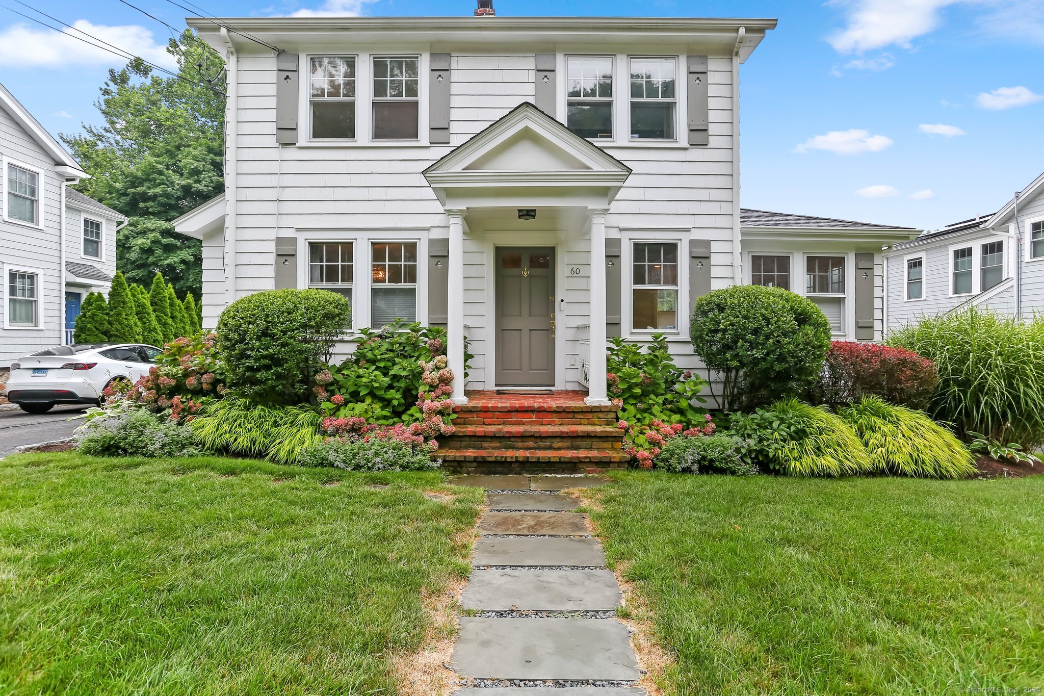 a front view of a house with a yard