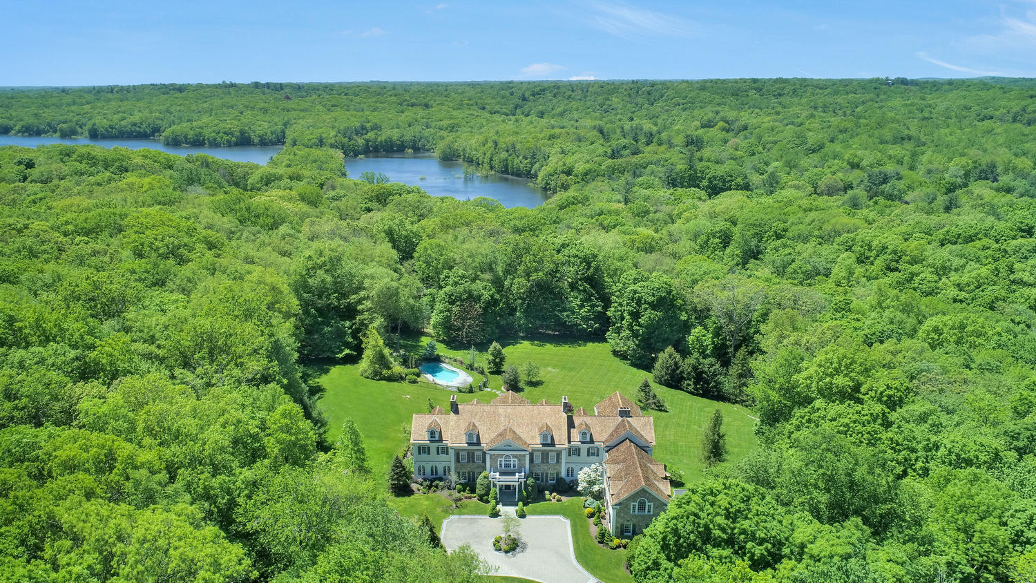 an aerial view of a house with outdoor space and street view