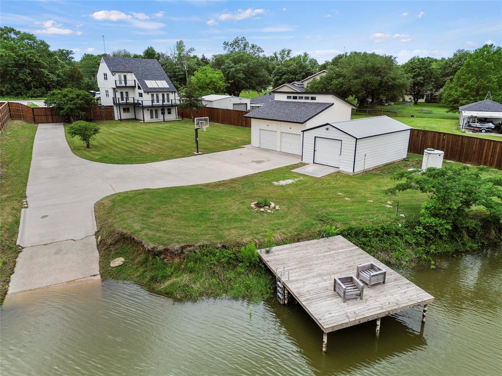 a view of a wooden deck and a lake view