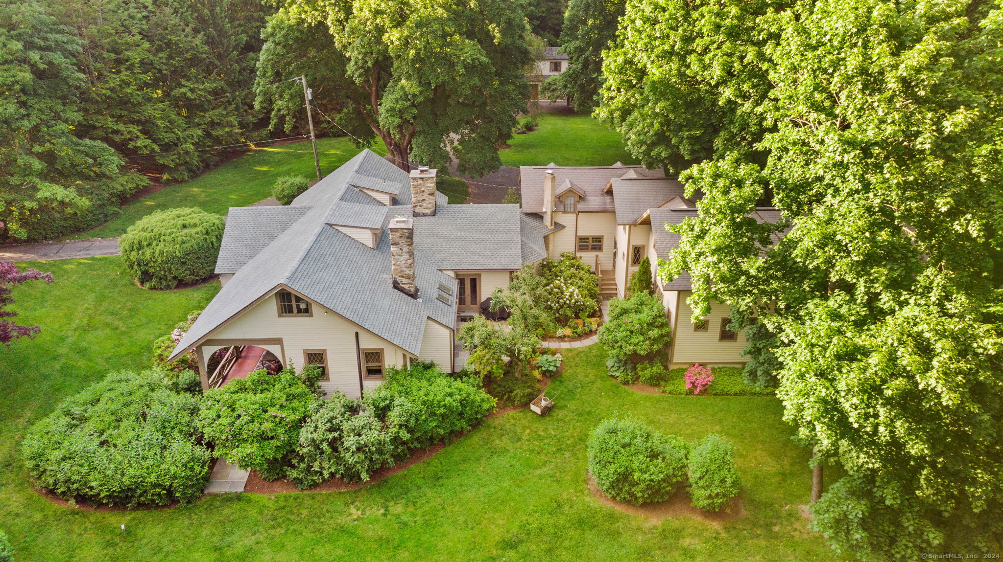 aerial view of a house with a yard