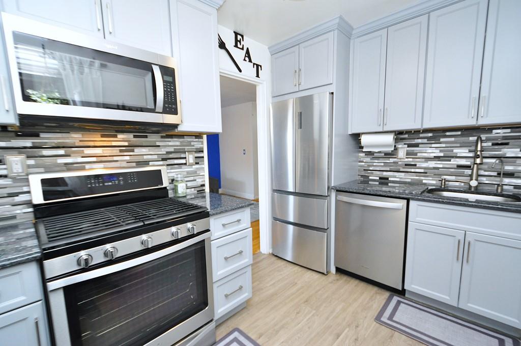 New Kitchen has Granite Counter and Stainless Steel Appliances including a Dishwasher, Microwave, Range and French Door Refrigerator. Custom cabinets extend to the ceiling providing extra storage,  There is also a window for ventilation.  You could even put a small table and chair.