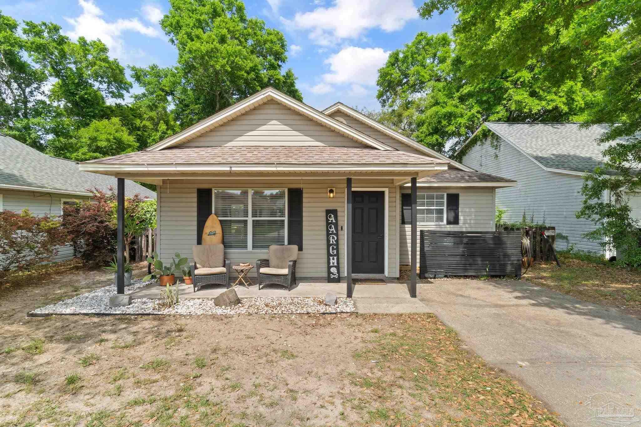 a front view of a house with a patio