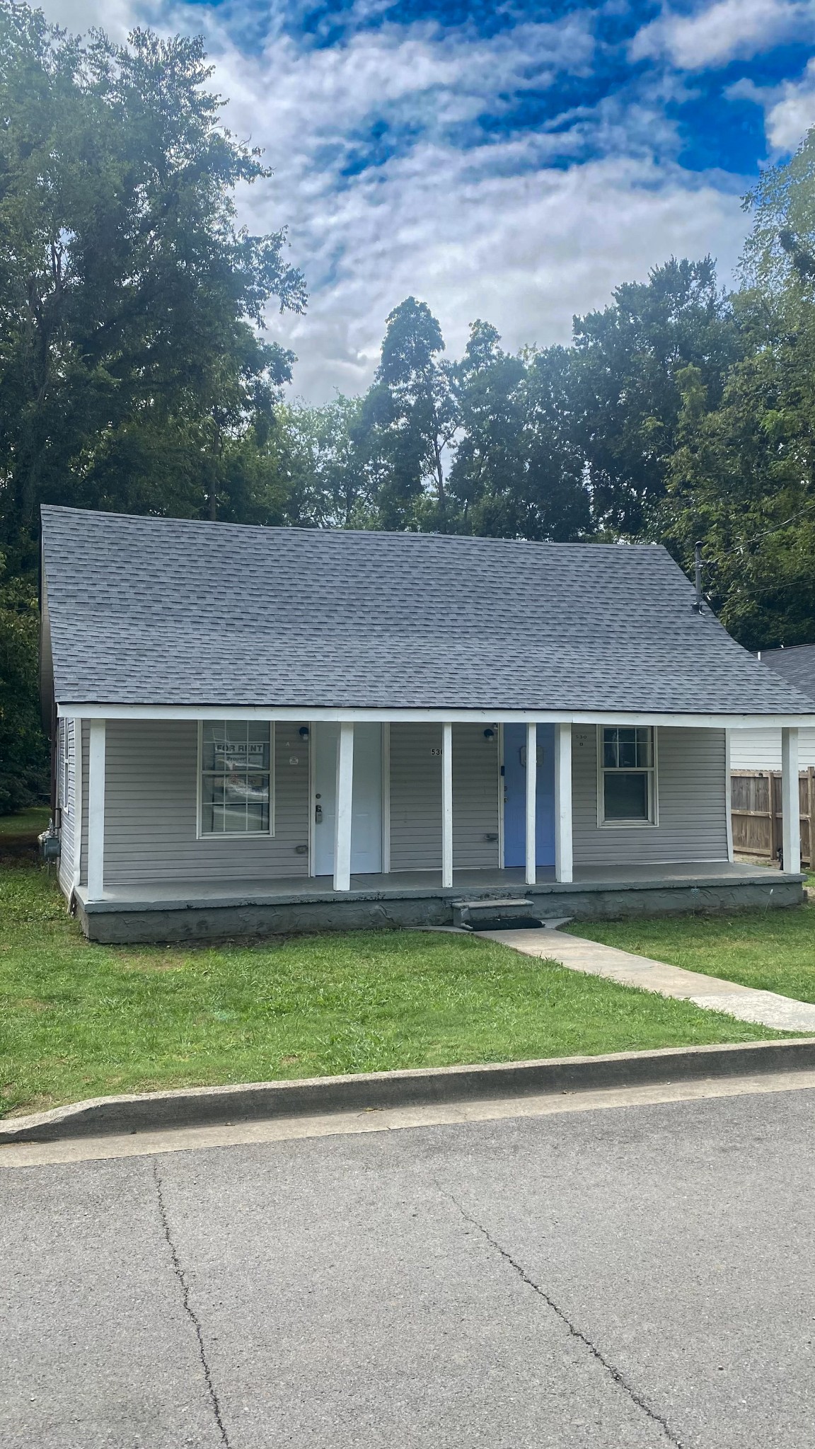 front view of a house with a yard