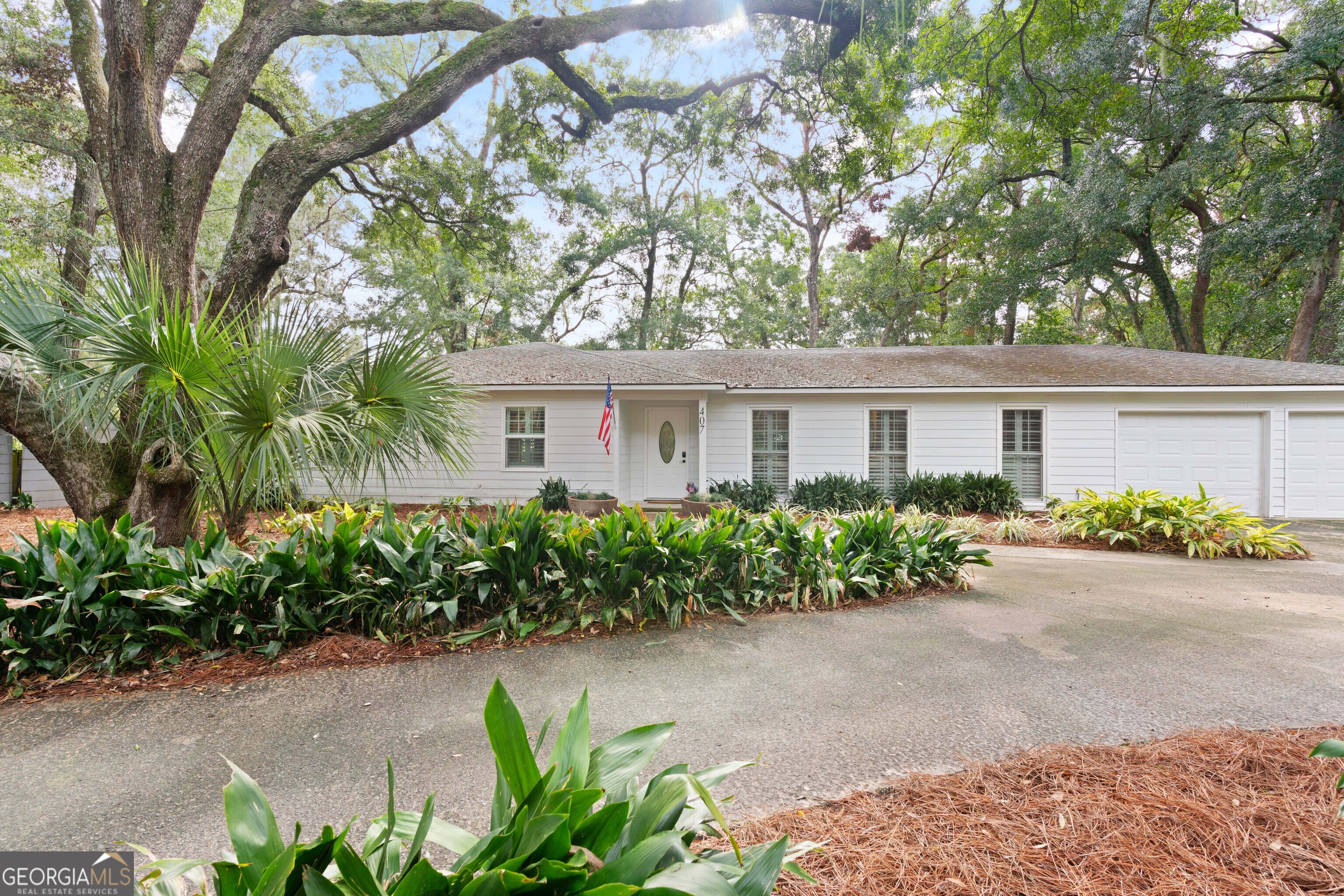 front view of a house with a garden