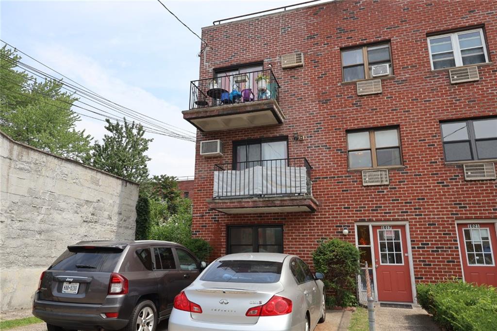 a front view of a house with parking space