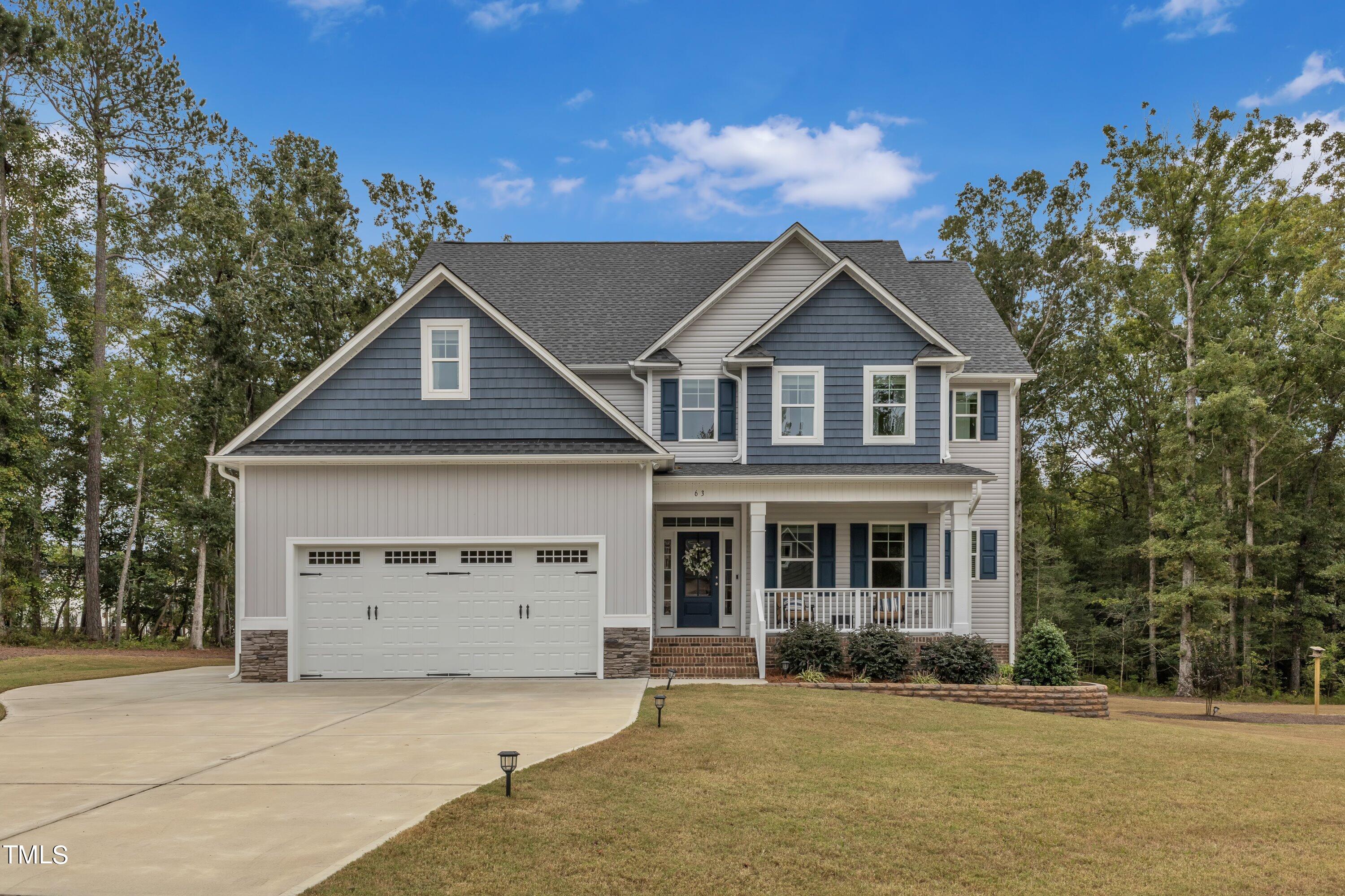 front view of a house with a yard