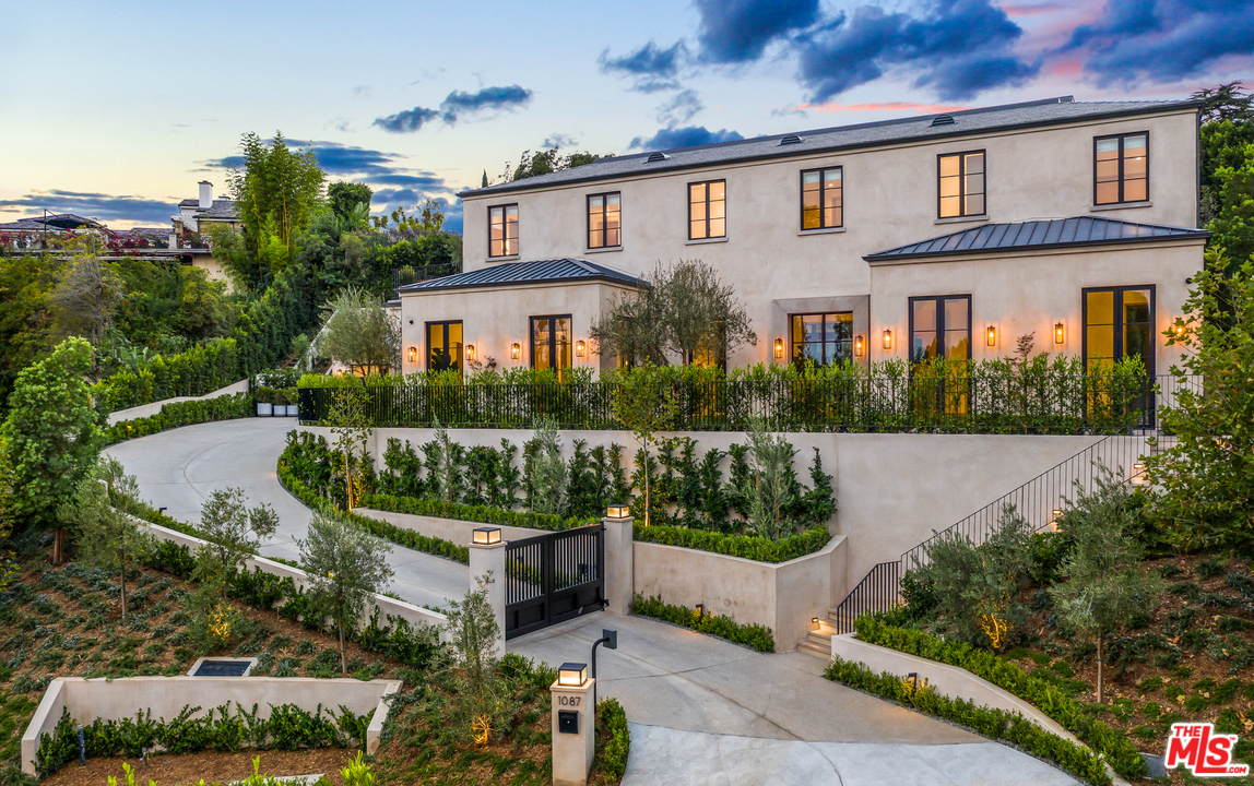 front view of a house with a garden