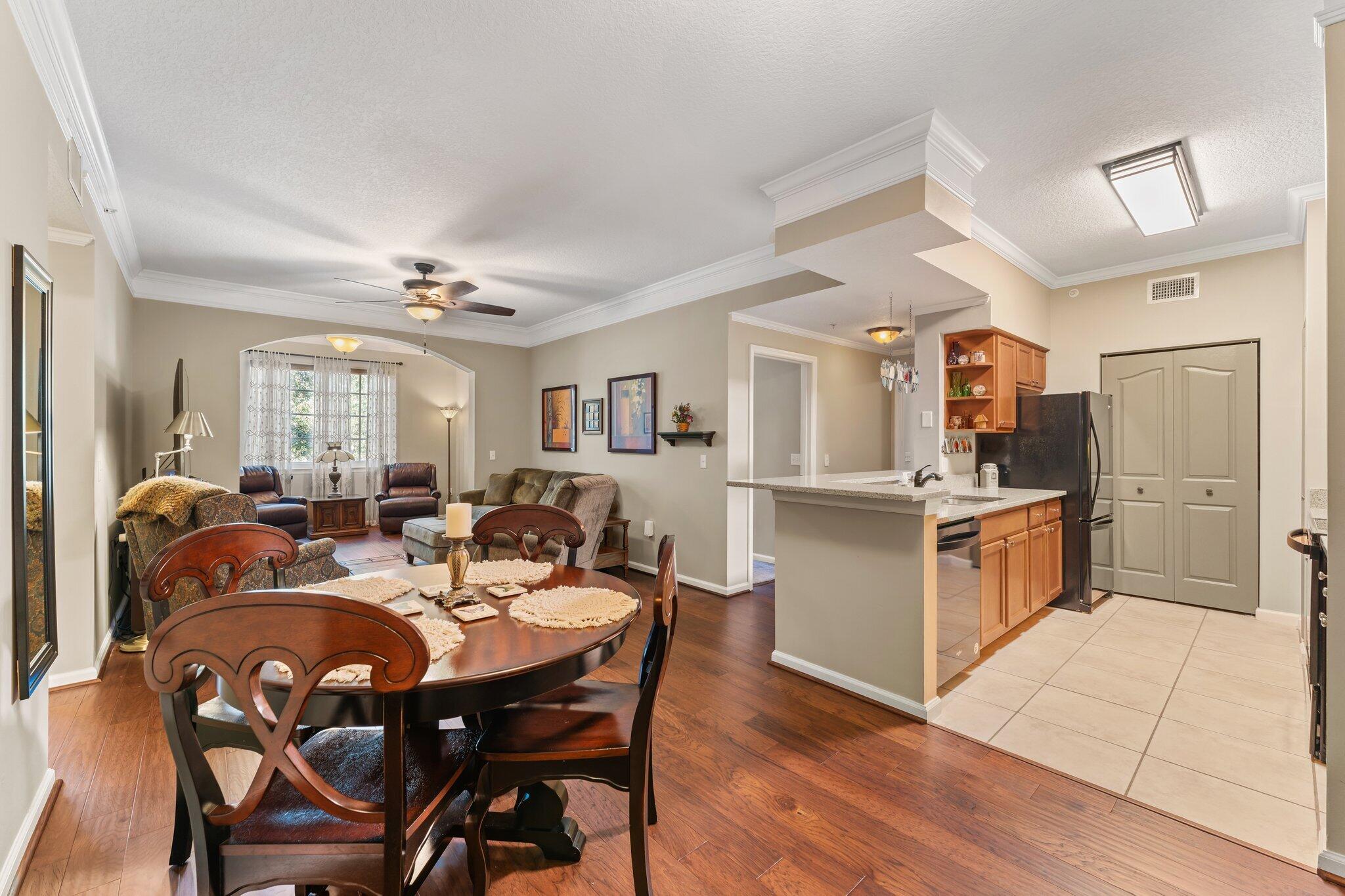 a view of a dining room with furniture and wooden floor