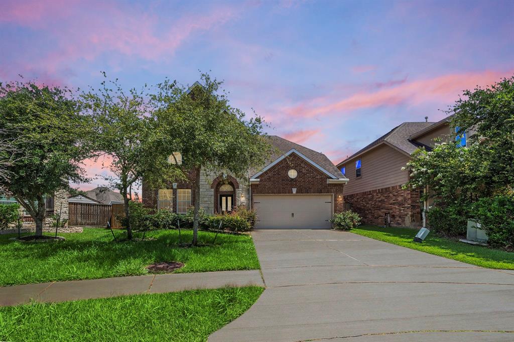 Welcome to this stunning 5-bedroom, 3-bath home in the sought-after Lakes of Bella Terra community. The front yard is beautifully landscaped with mature trees and lush greenery, providing excellent curb appeal.