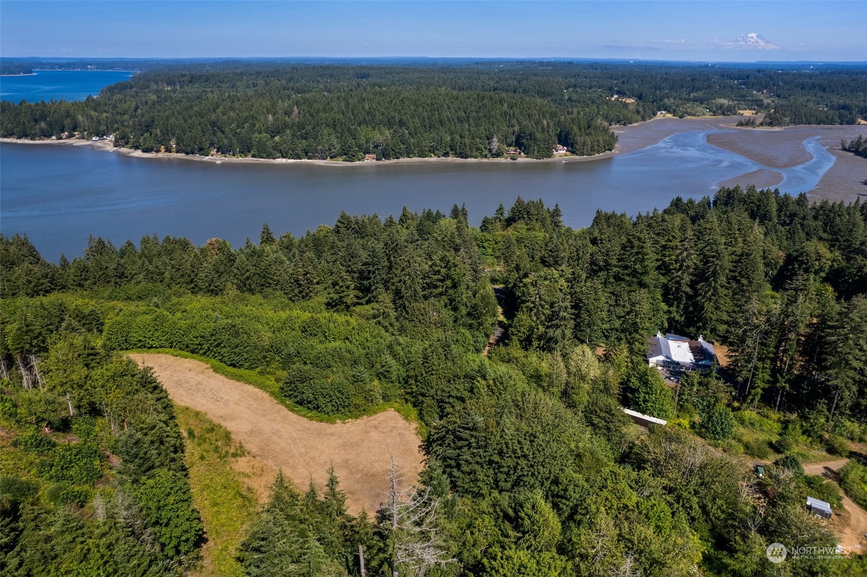 an aerial view of a house with a lake view