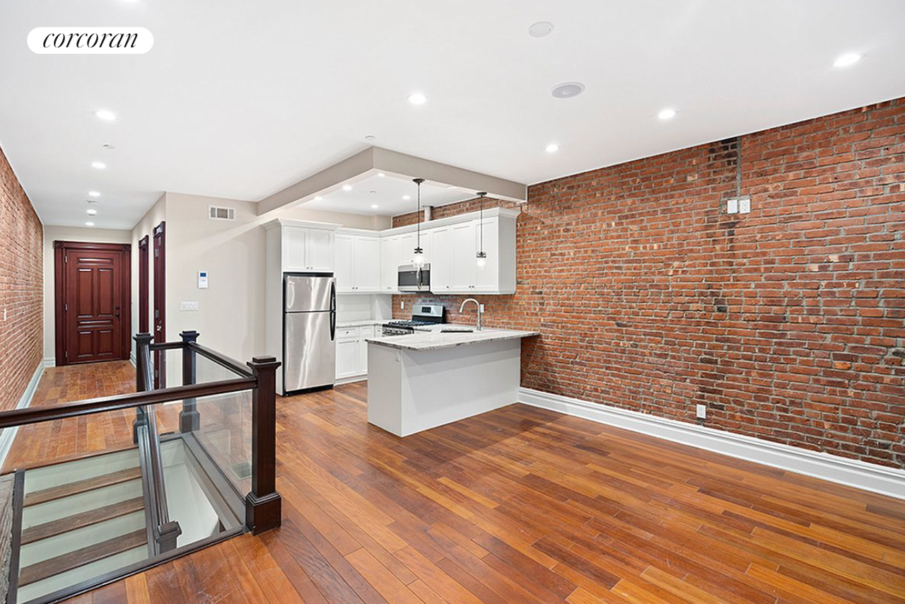 a view of kitchen with wooden floor