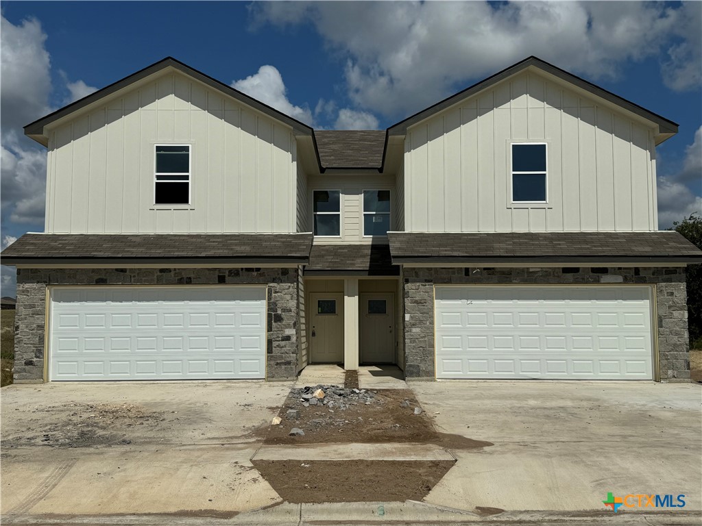 a view of a house with garage