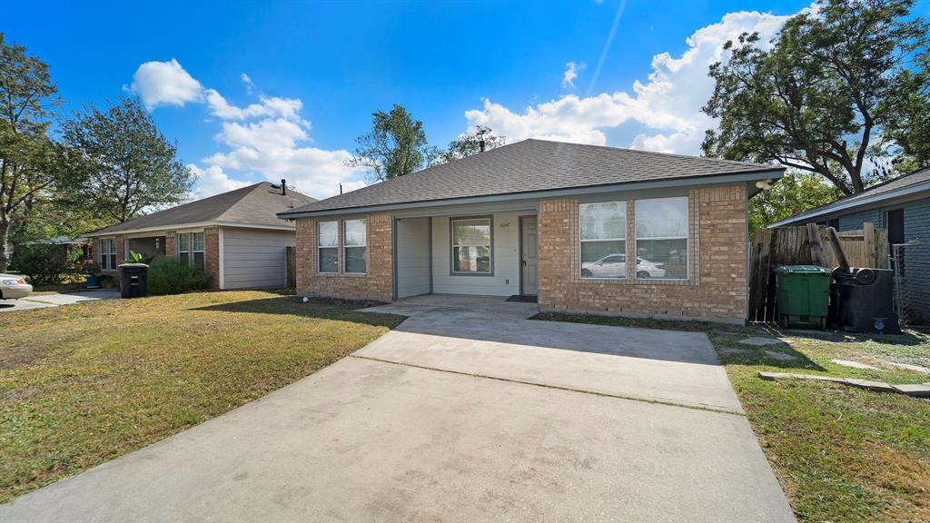 front view of a house with a yard