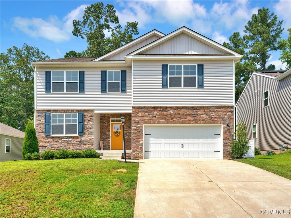 View of front of property with a front yard and a