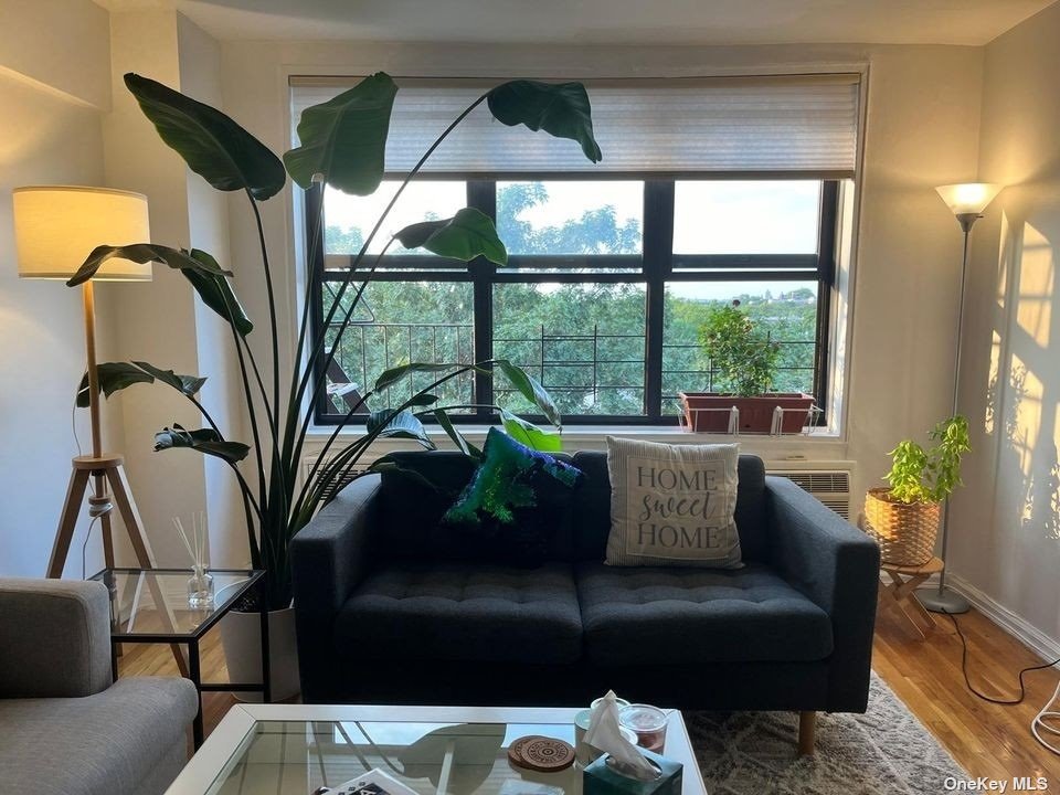 a living room with furniture and a large window