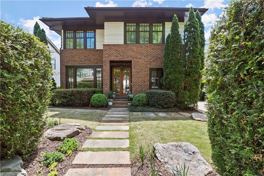 a front view of a house with garden