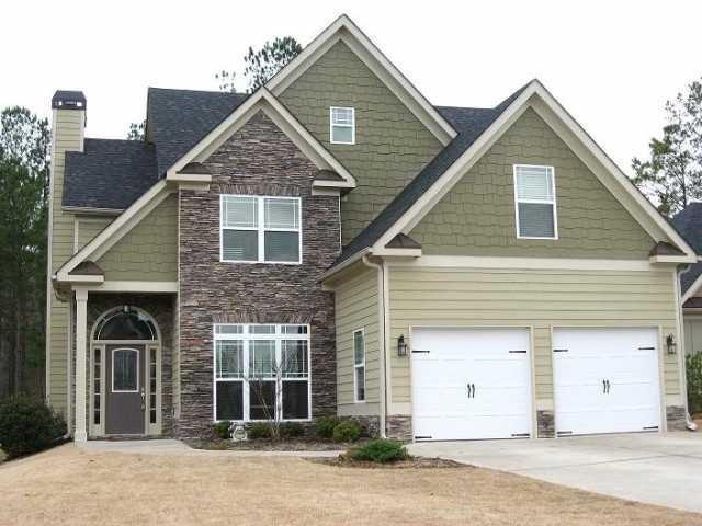 a front view of a house with a garage