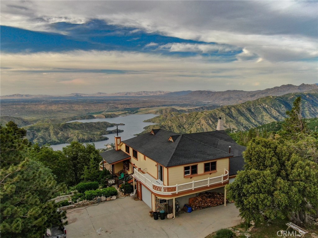 a aerial view of a house with a yard