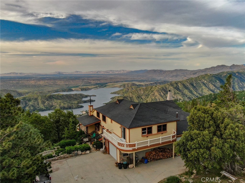 a aerial view of a house with a yard