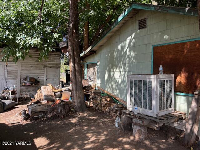 a view of backyard with wheel chair and potted plants