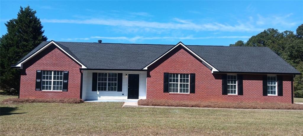 front view of a house with a yard