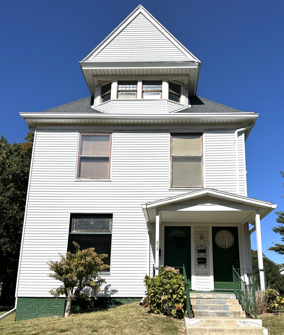 a front view of a house with yard