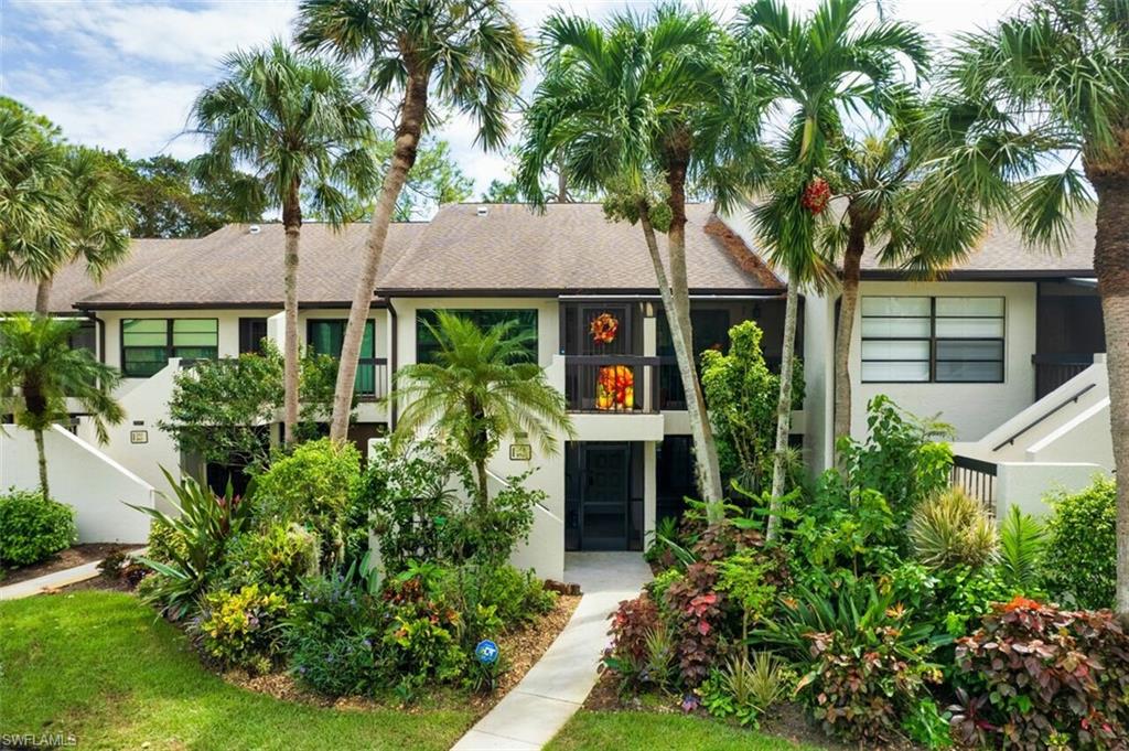 front view of a house with a garden