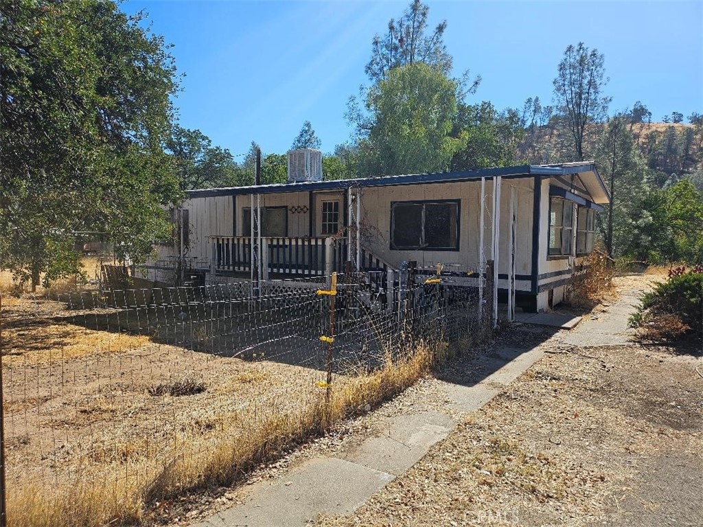 a view of backyard patio and deck