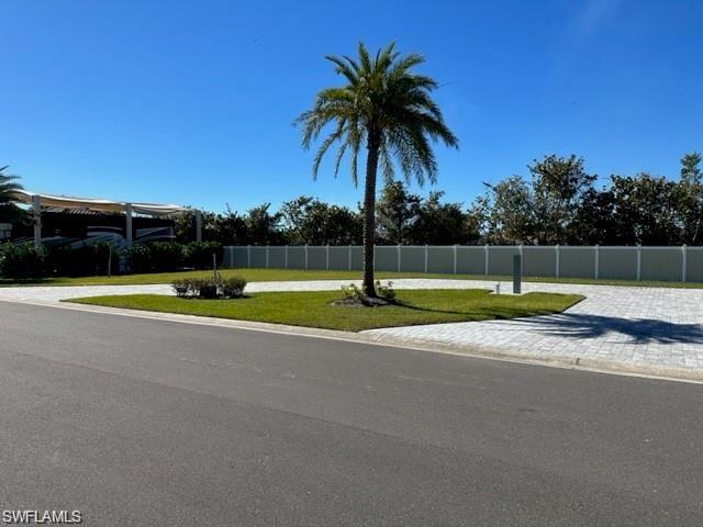 a view of a swimming pool with a yard