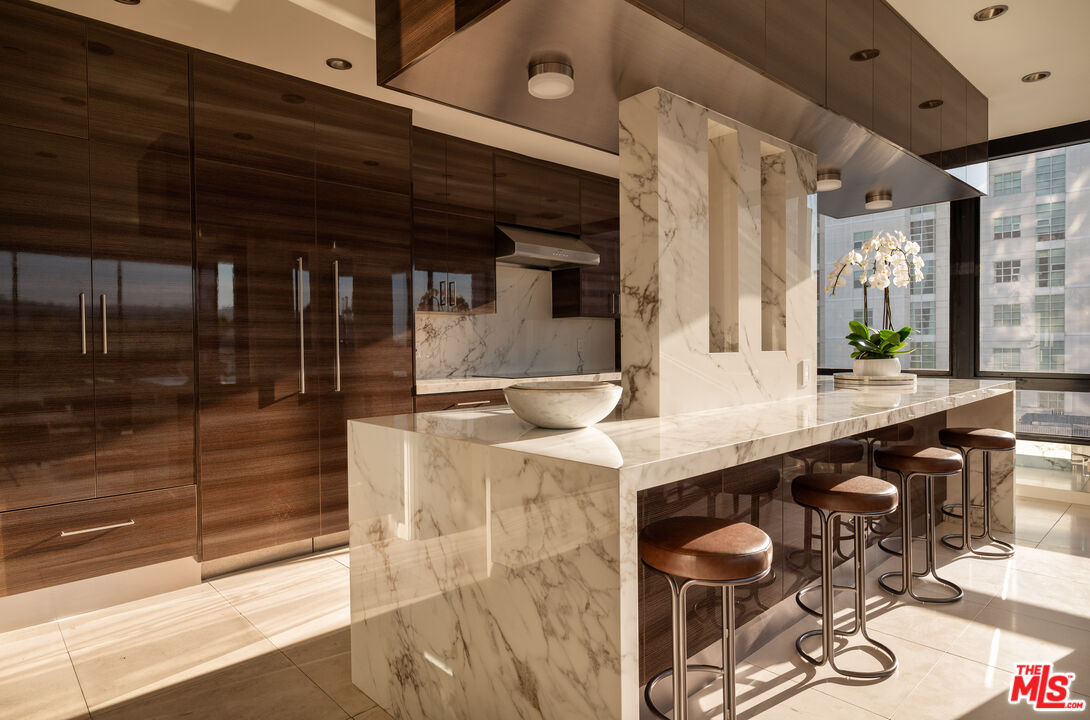 a bathroom with a sink a mirror and bathtub