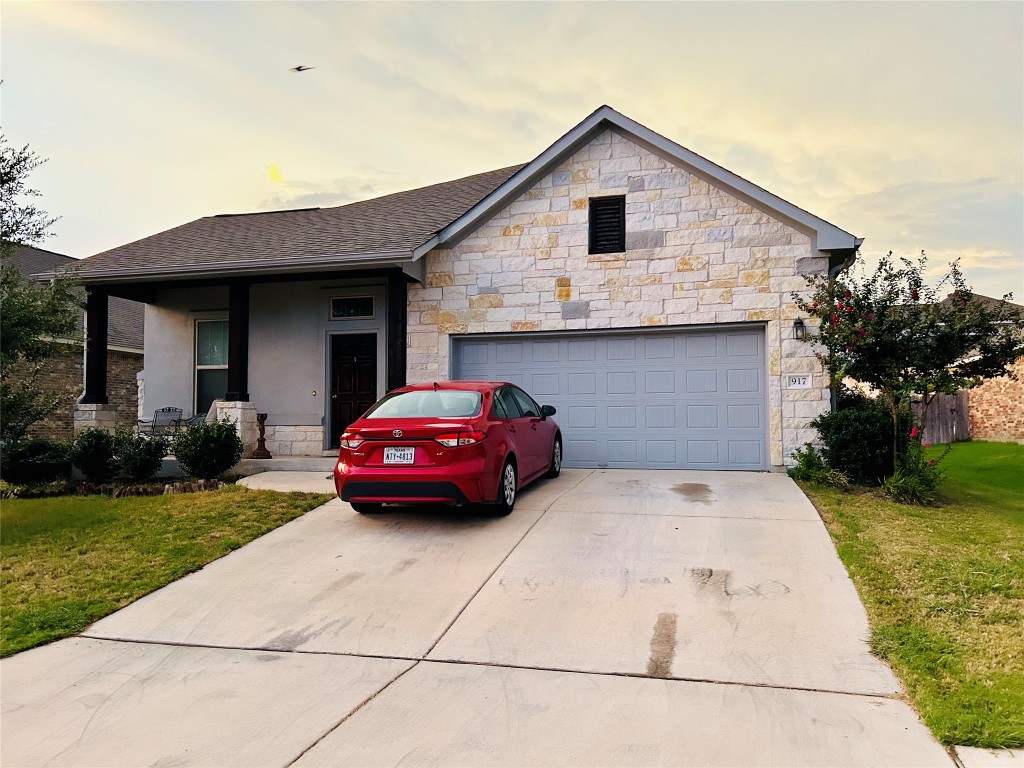 a view of a car parked in front of a house