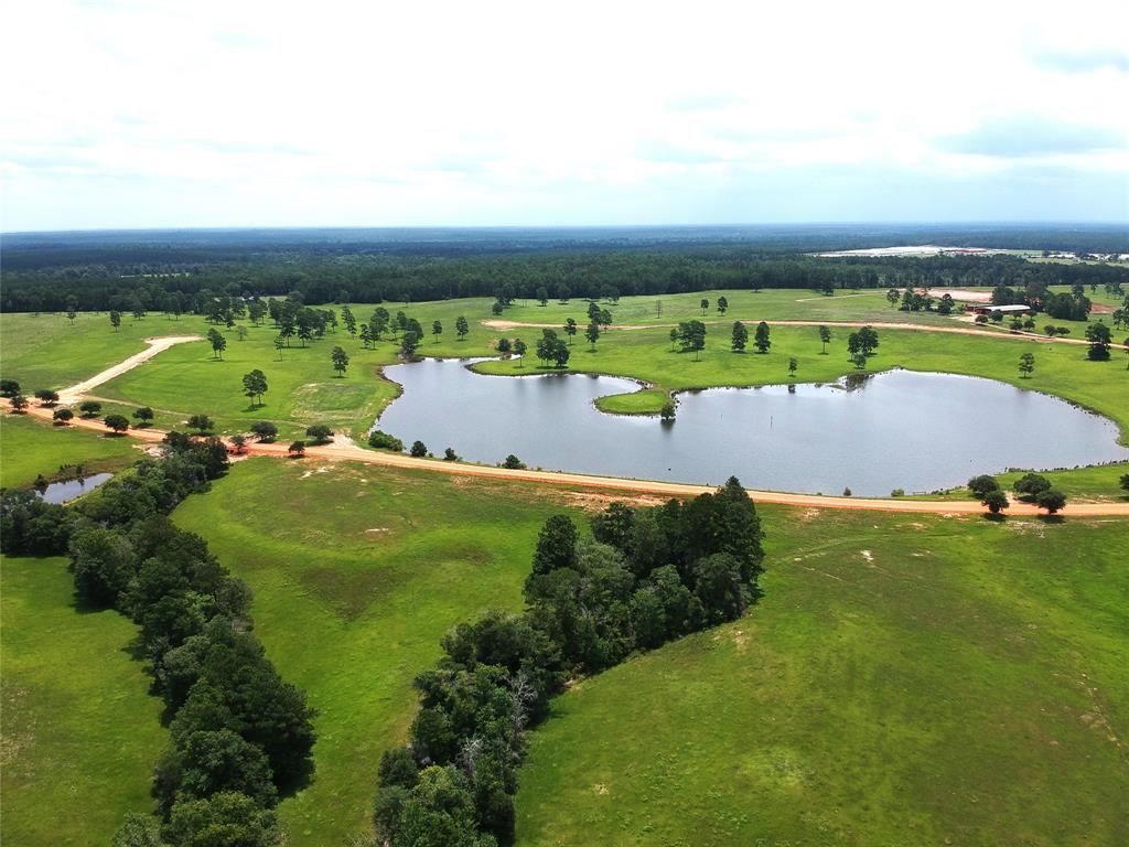 an aerial view of a golf course with swimming pool