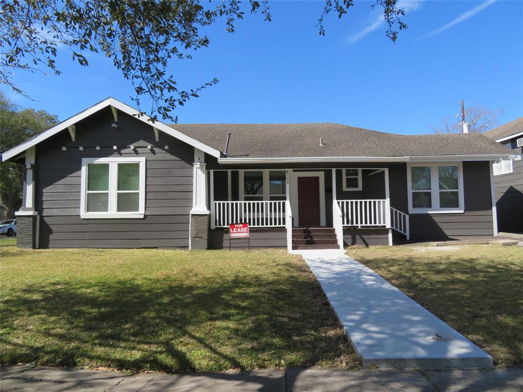 a front view of a house with yard floor and porch