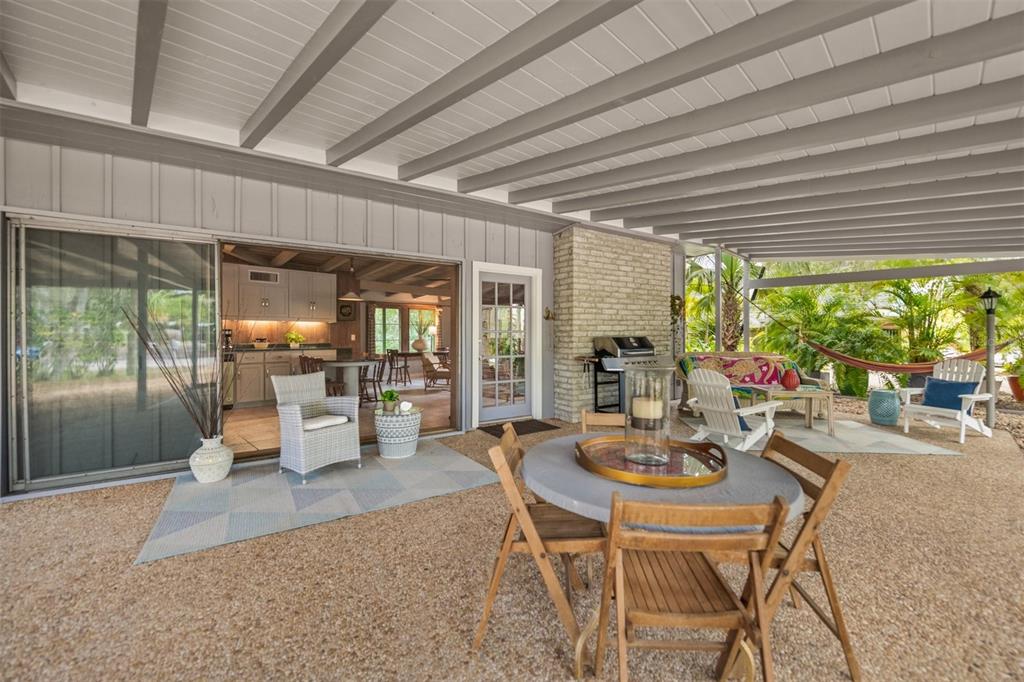 a dining room with furniture window and outside view