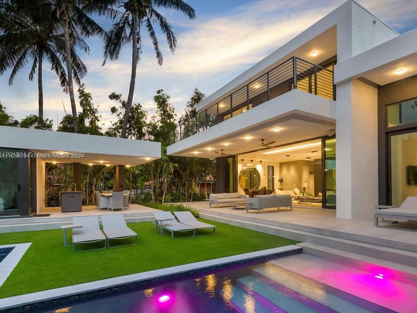 a view of a swimming pool with a table and chairs