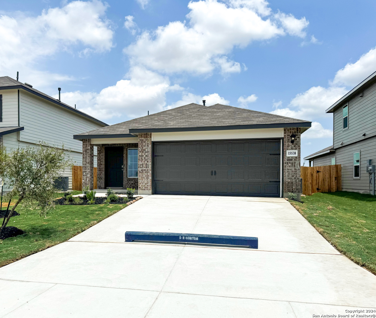 a front view of a house with yard