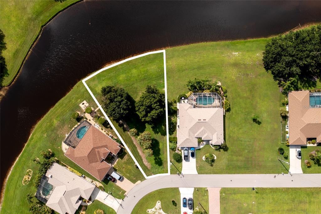 an aerial view of a house with a swimming pool