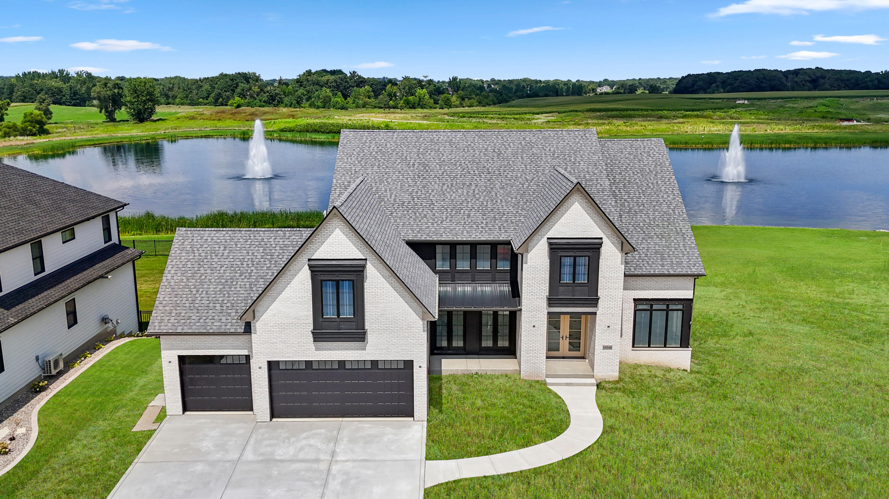 a view of a house with a yard and a swimming pool