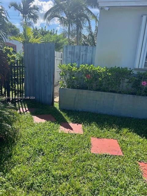 a wooden fence with some plants