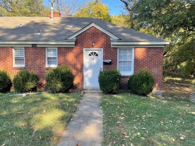 View of front of house with a front lawn