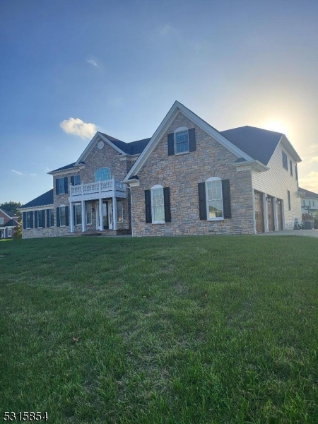 a brick house with a big yard