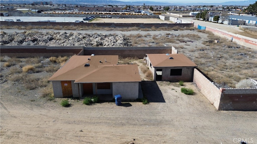 a front view of a house with a yard and ocean view