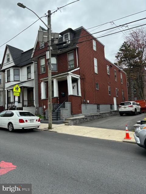 a view of street with parked cars