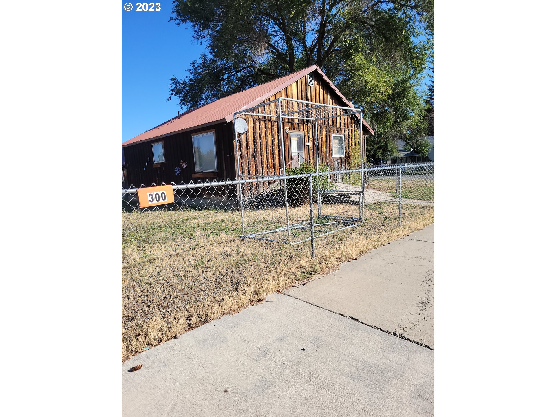 a view of a house with a small yard