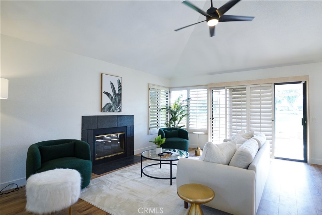 a living room with furniture and a fireplace