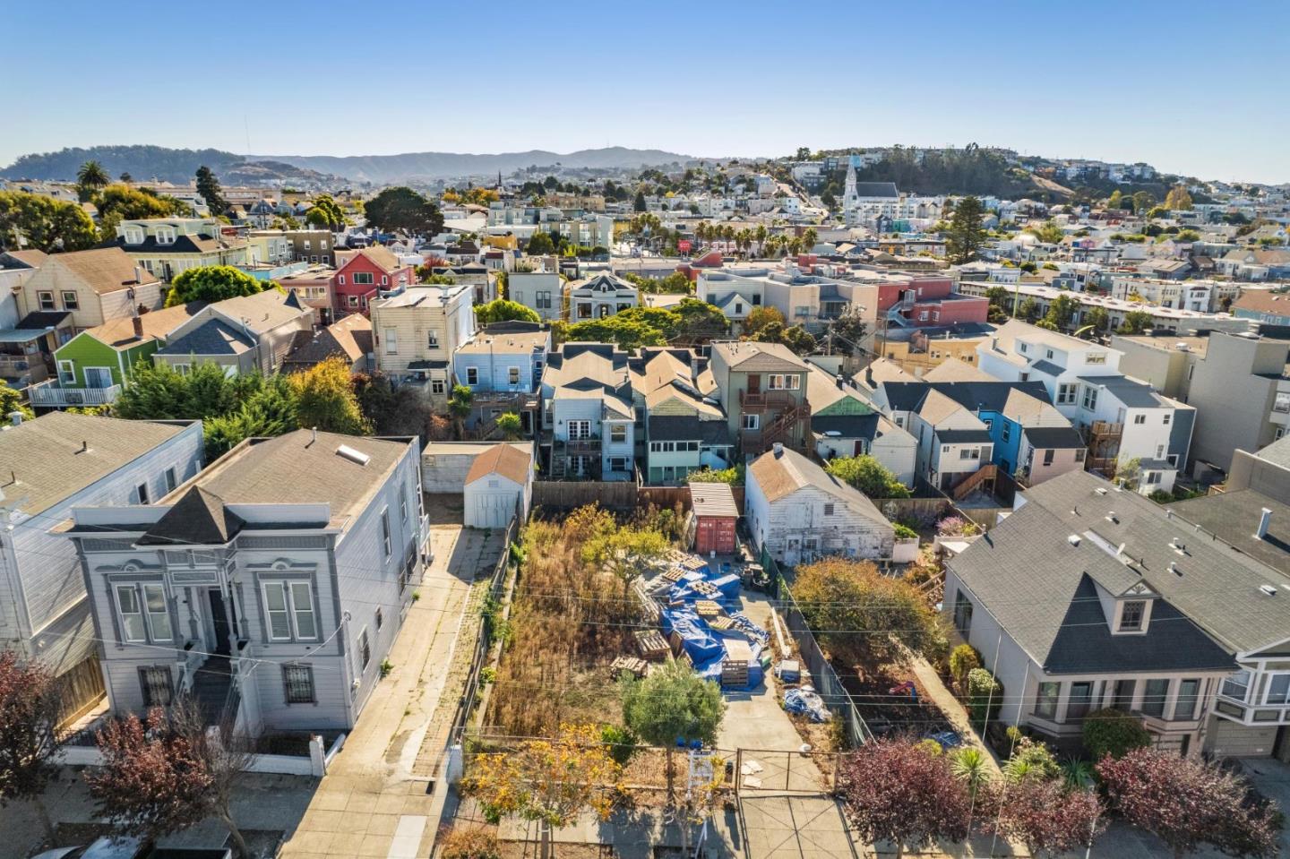 an aerial view of a city with lots of residential buildings