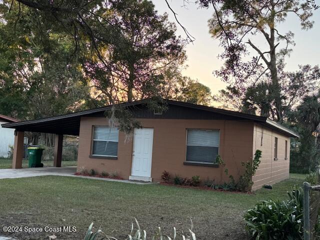 a house that has a tree in front of it